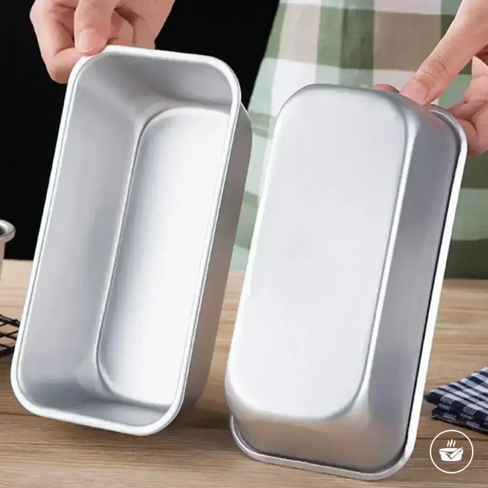 Carbon steel mini loaf pan with non-stick rectangular bread mold form.